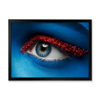 DesignArt 'žensko oči s plavom bojom na licu i crvenim kuglicama' moderni uokvireni umjetnički tisak
